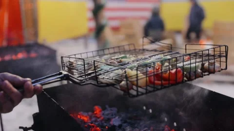 Chef cooking vegetable on the grill in the restaurant outdoor kitchen Stock Footage 132696866