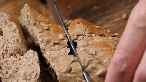 Chef cooking vegetable salad for breakfast slicing the bread baguette Stock Footage 84699221