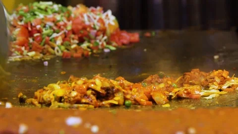 A Chef Cooking Vegetables on a hot pan Stock Footage 108251783
