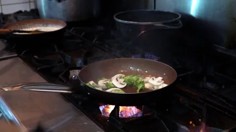Chef Cooking Vegetables in Kitchen Stock Footage 318303807