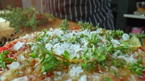 Chef cooks beef steak, add pepper and spices to the steak. Food preparation. Stock Footage 234322098