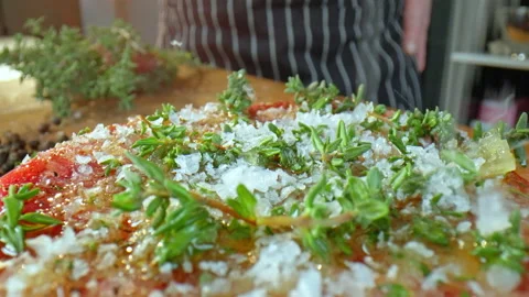 Chef cooks beef steak, sprinkling with salt. Food preparation. Stock Footage 233014576