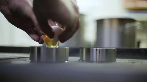 A chef cooks eggs yolks Stock Footage 70171832