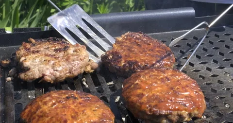 Chef Cooks Meat Cutlets on Grill. With tongs Turns Meat to Other Side. Food Stock Footage 132336372