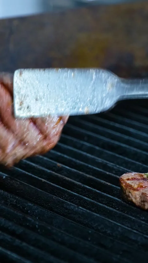 Chef Cooks Meat Tongs Vertical Video Stock-Footage 334878436
