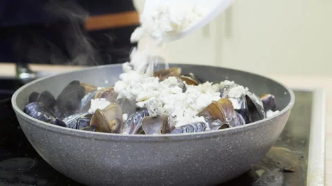 The chef cooks mussels in shells. Stock Footage 171625224