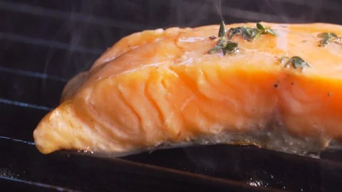Chef cooks red fish on the grill, wholesome food, salmon Stock Footage 116687731