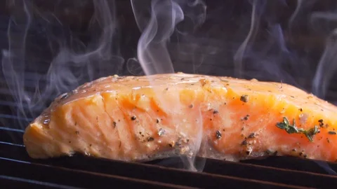 Chef cooks red fish on the grill, wholesome food, salmon Stock Footage 116688134