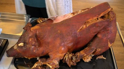 Chef cooks a suckling pig Stock Footage 90302619
