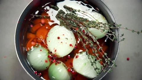 Chef cooks vegetable broth with carrot onion and spices Stock Footage 143776990