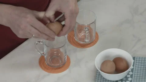 Chef Crack Egg and Separating White from Yolk Stock Footage 164018489