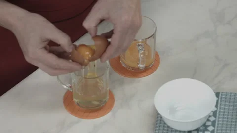 Chef Cracking Egg and Separate White from Yolk Stock Footage 164018458