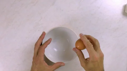 Chef cracking egg into bowl Stock Footage 99542565