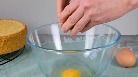 Chef cracking an egg in a bowl Stock Footage 256655691