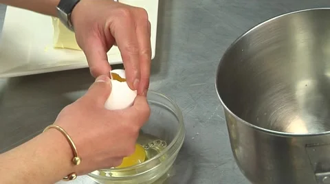 Chef Cracks Eggs - Seperates Yolks Stock Footage 52800468