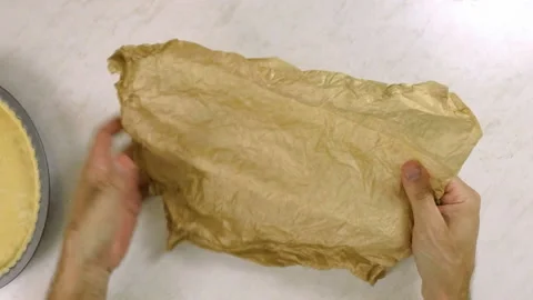 Chef crumpling baking parchment Stock Footage 100231423