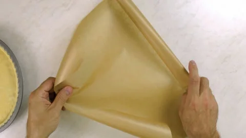 Chef crumpling baking parchment Stock Footage 100231651