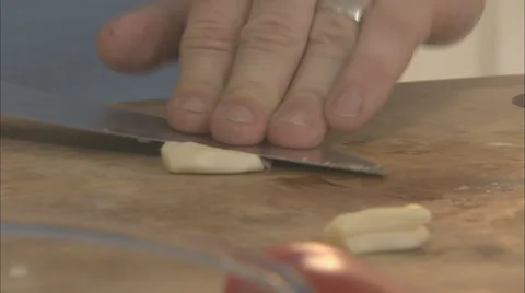 Chef crushing garlic Stock Footage 39588167