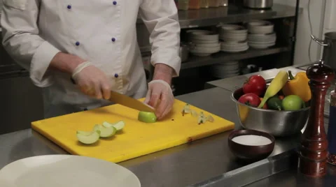 Chef curving an apple, medium shot Stock Footage 66075752
