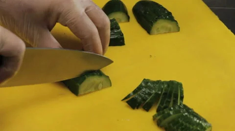 Chef curving a fresh cucumber, close up Stock Footage 66064948