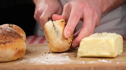 Chef cut bread Stock Footage 240134423