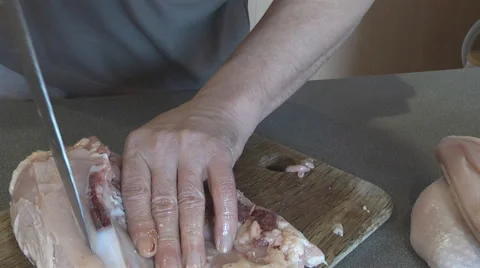 Chef cut up chicken in the kitchen Stock Footage 46686303