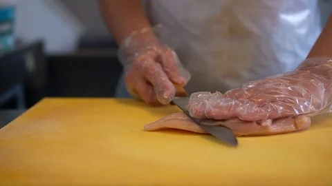 Chef cut the Chicken Meat with Knife Stock Footage 111411334