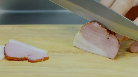 The chef cut cool bacon. Stock Footage 70973036