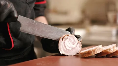 Chef cut with kitchen knife piece of smoked lamb meat Stock Footage 202204491
