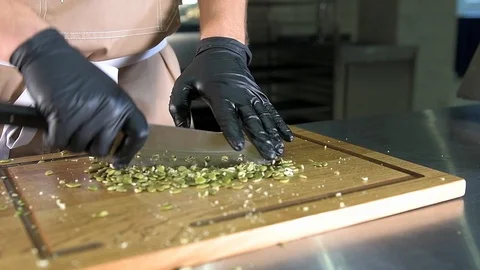 The chef cut the pumpkin seeds Stock Footage 97881022