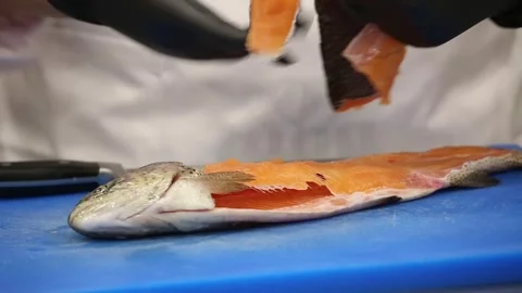 The chef cut off  salmon and remove the thorns 16 Stock Footage 312932049