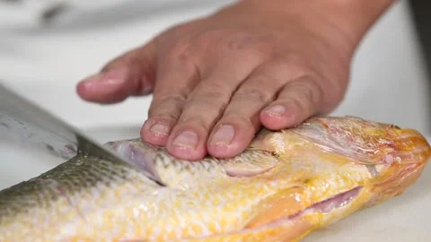 Chef cut yellow croaker with a knife (2) Stock Footage 202206008