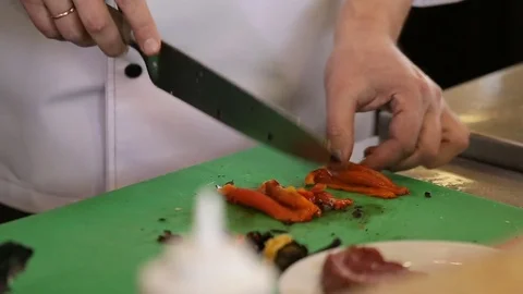 Chef cutes red pepper Stock Footage 74716042