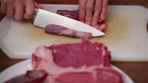 Chef cuts beef -  cut off fat from meat Stock Footage 44727540