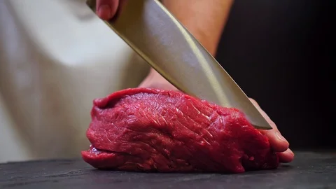 Chef cuts beef for steak Stock Footage 121416094