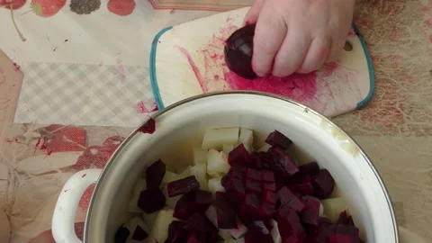 The chef cuts beets with a knife Stock Footage 165613179