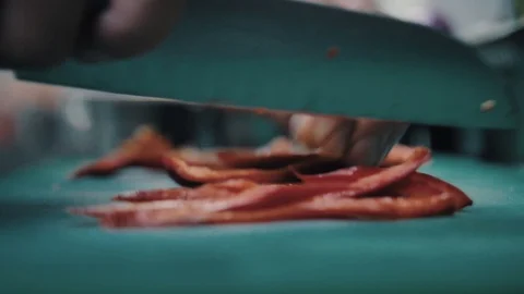Chef cuts bell pepper so close Stock Footage 112587571