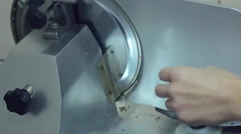 Chef cuts boiled beef meet with a slicer Stock Footage 58858599