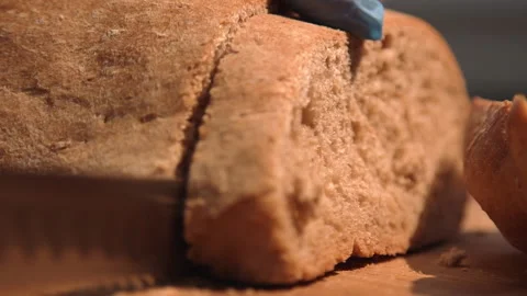 The chef cuts bread for a sandwich Stock Footage 158021779