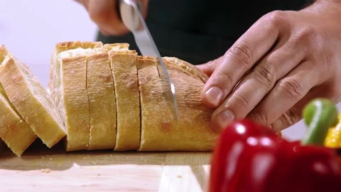 Chef cuts the bread slow motion Video stock 146750615