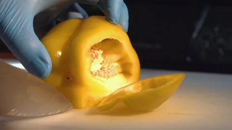 The chef cuts the bulgarian pepper into cubes Stock Footage 157982034