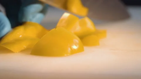 The chef cuts the bulgarian pepper into cubes Stock Footage 158020325