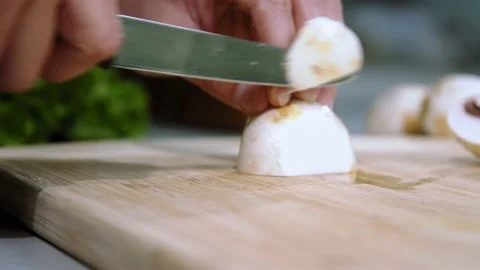 Chef cuts the champignons Stock Footage 151470681