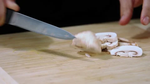 Chef cuts the champignons Stock Footage 219733835