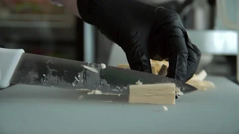 The chef cuts the cheese for cooking Vídeo Stock 137828003