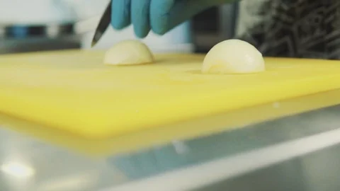 The chef cuts a close-up onions Stock Footage 89842469