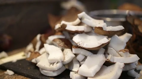 Chef cuts coconut to prepare coconut milk. healthy ingredients for dish Stock Footage 207912130