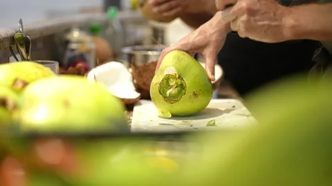 Chef cuts coconut to prepare coconut milk. healthy ingredients for dish Stock Footage 207912158