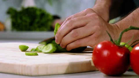 Chef cuts cucumber slow motion Video stock 236206761