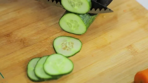 Chef cuts the cucumber into small pieces Stock Footage 160497206